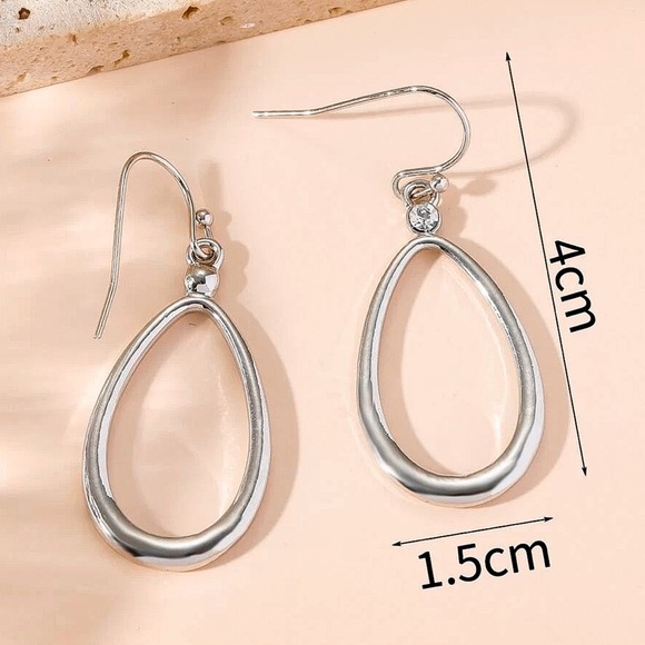 Any 2/$20! Shiny Silver Tubular Oval Drop Earrings - Picture 3 of 5